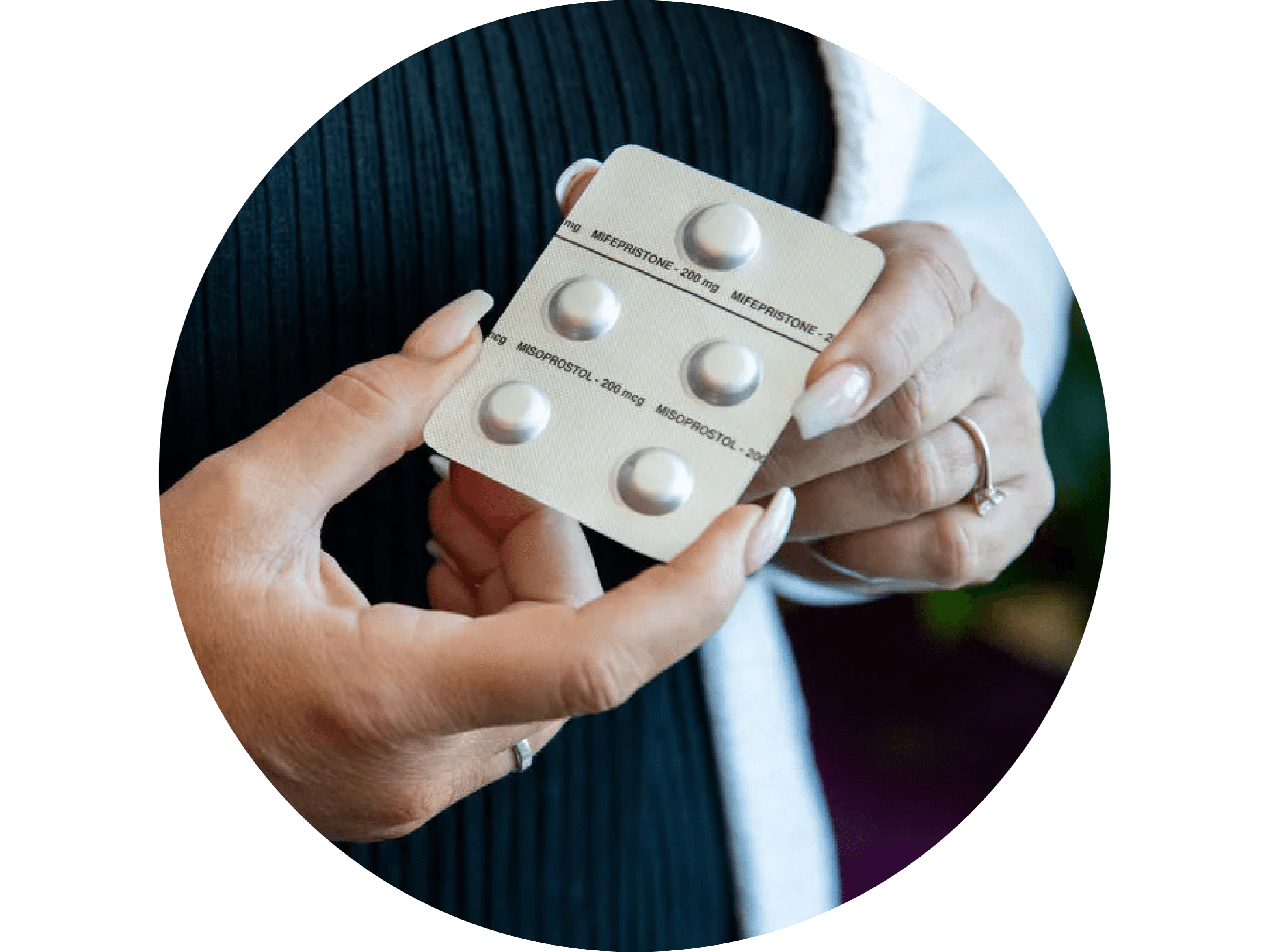 Melissa hands holding abortion pill blister pack circle Melissa hands holding abortion pill blister pack circle